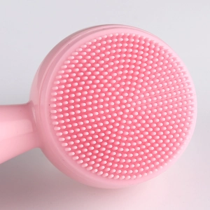 Macro detail of cat paw silicone facial cleansing brush with soft massaging bristles