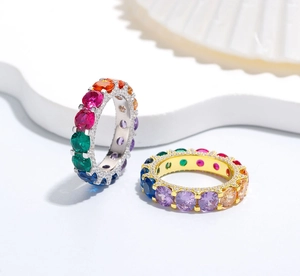 Close-up of S925 silver rainbow eternity rings with colorful round-cut gemstones