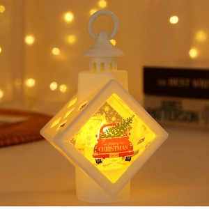 Detail of white Christmas LED lantern with warm light and festive red truck pattern