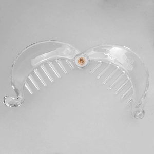 Detail of transparent banana hair clip with golden rivet and embossed A.S MIRACLE text
