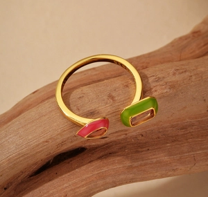 Detail view of S925 sterling silver ring with colorful enamel and S925 stamp on driftwood