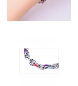 Macro detail of titanium chain bracelet with colorful enamel links in streetwear style