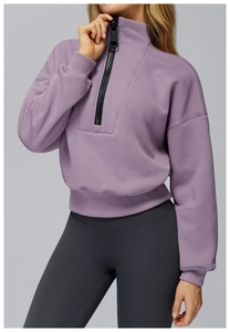 Detail of lavender half-zip sweatshirt with stand collar and ribbed cuffs for sports