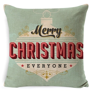 Detail of light green linen pillowcase featuring red Merry Christmas vintage ball design