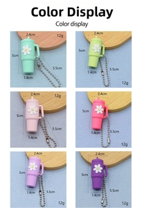 Detailed color display of mini tumbler keychains with floral daisy charms in six colors