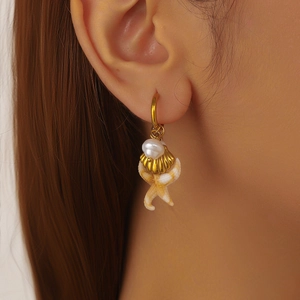 Gold-plated hoop earrings featuring starfish, seashells and pearls for beach vacation