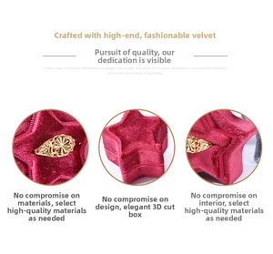 Macro detail of red star-shaped velvet jewelry box featuring inner slot and gold gear accent
