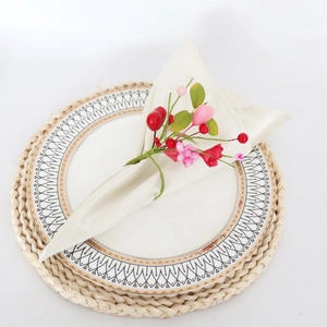 Pink and red floral heart napkin ring with berries on a beige fabric napkin