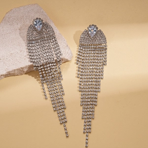 Silver fringe tassel earrings with geometric zircon drop stones on stone pedestal