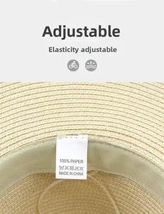 Dettaglio dell'elastico regolabile e dell'etichetta 100% carta all'interno del cappello