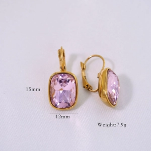 Detail view of 14K gold earrings with faceted pink rectangular gems and 15x12mm dimensions