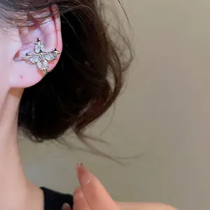 Elegant silver starburst ear cuff for women with zircon inlay on ear cartilage