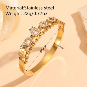 Elegant gold vacuum plated stainless steel hollow bangle with cubic zirconia accents