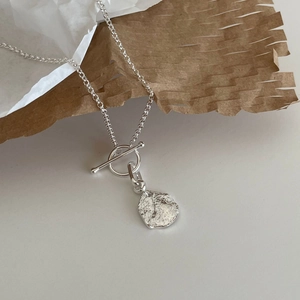 Minimalist 925 sterling silver necklace with T-bar clasp and irregular textured pendant
