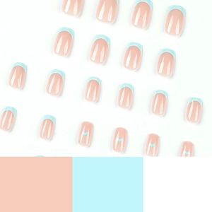 Blue and white French press-on nails with heart designs for a minimalist sweet style