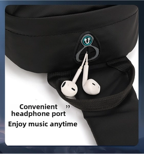 Detail showing high-density nylon fabric and rubber headphone jack on black chest bag