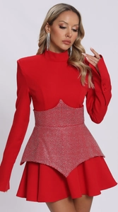 Detailed view of red long sleeve dress with waist silver rhinestone embellishments