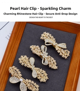Close-up of elegant pearl and rhinestone hair clips with non-drop diamond craftsmanship