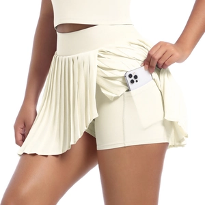 Detail of pleated sports skort with a side pocket for holding a smartphone