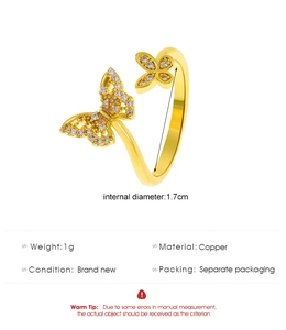 Detail of copper butterfly ring with white zircon stones weighing 1g and 1.7cm diameter