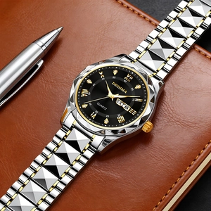 Detail of quartz watch with black dial and dual calendar on brown leather notebook