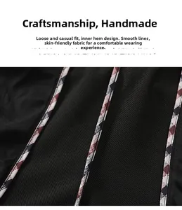 Detail of men's athletic pants showing breathable mesh lining and plaid piping trim
