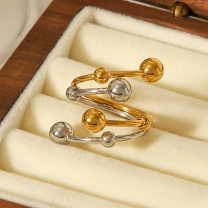 Two-tone silver and gold stainless steel double layer spiral ring with metallic beads