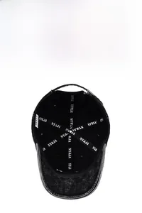 Macro detail of washed denim baseball cap interior featuring NY&JA sweatband and vintage worn edges