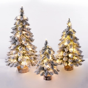 Mini flocked Nordic Christmas trees with warm LED lights and wooden base set of three