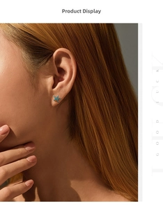 Close-up of S925 silver starfish stud earring featuring turquoise stones on a model ear