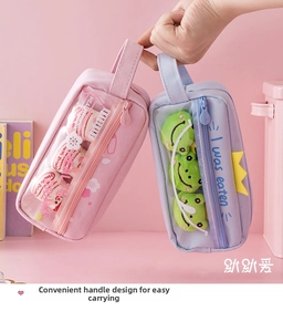 Detail showing candy-colored pencil cases with clear PVC windows and plush accessories