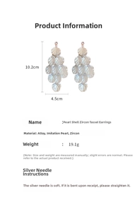 Detail view of pearl shell tassel earrings with specific dimensions and material specs