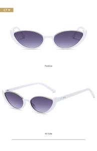 Detail view of retro cat-eye sunglasses with white semi-rimless frames and purple gradient lenses