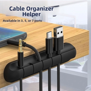 Close-up of a 5-slot silicone desktop cable organizer holding multiple USB and audio wires