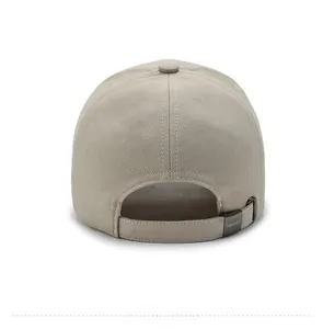 Detail of adjustable metal buckle with narason logo on beige fabric baseball cap