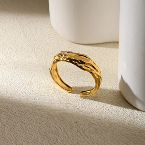 Detail of 18K gold-plated irregular lava texture open ring with metallic luster