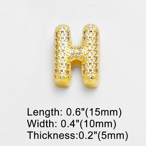Macro shot of gold-plated letter H charm with sparkling cubic zirconia, size 15x10x5mm