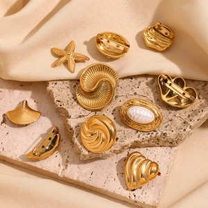 Vintage 18K gold-plated stainless steel heart and shell brooches on silk fabric