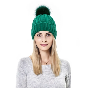 Detail of emerald green knit beanie with large faux fur pompom and ribbed texture