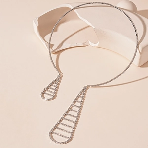 Silver geometric open collar necklace with rhinestone waterdrop charms on stone