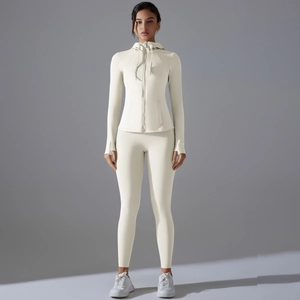 Set da yoga beige due pezzi da donna con giacca con cappuccio e leggings a vita alta