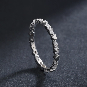 Minimalist s925 silver heart ring with sparkling cubic zirconia on a dark background