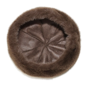 Top view of faux mink leopard beret showing inner lining and hexagonal stitching