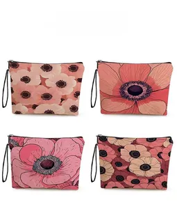 Set of four floral toiletry bags with pink anemone patterns and black zipper handles