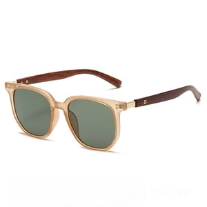 Detail of vintage Y2K rimless sunglasses with wooden texture temples and metal accents