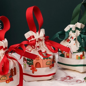 Three Christmas canvas gift bags with festive gingerbread and snowman prints