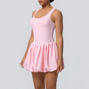 Detail view of pink sleeveless tennis dress with pleated skirt for fitness and running