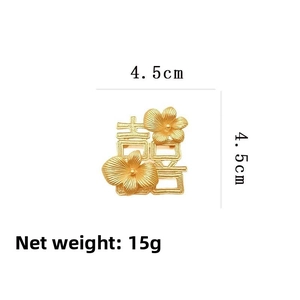 Detailed view of matte gold Xi character flower brooch measuring 4.5cm x 4.5cm
