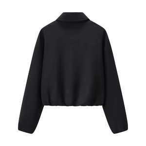 Vue arrière d'une veste courte noire à manches longues avec ourlet élastiqué