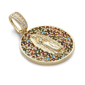 Detailed macro of 14K gold plated Virgin Mary pendant with colorful zircon stones